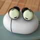 The Google Pixel Buds Pro earbuds sitting atop its charging case on a Pixel 5 smartphone.